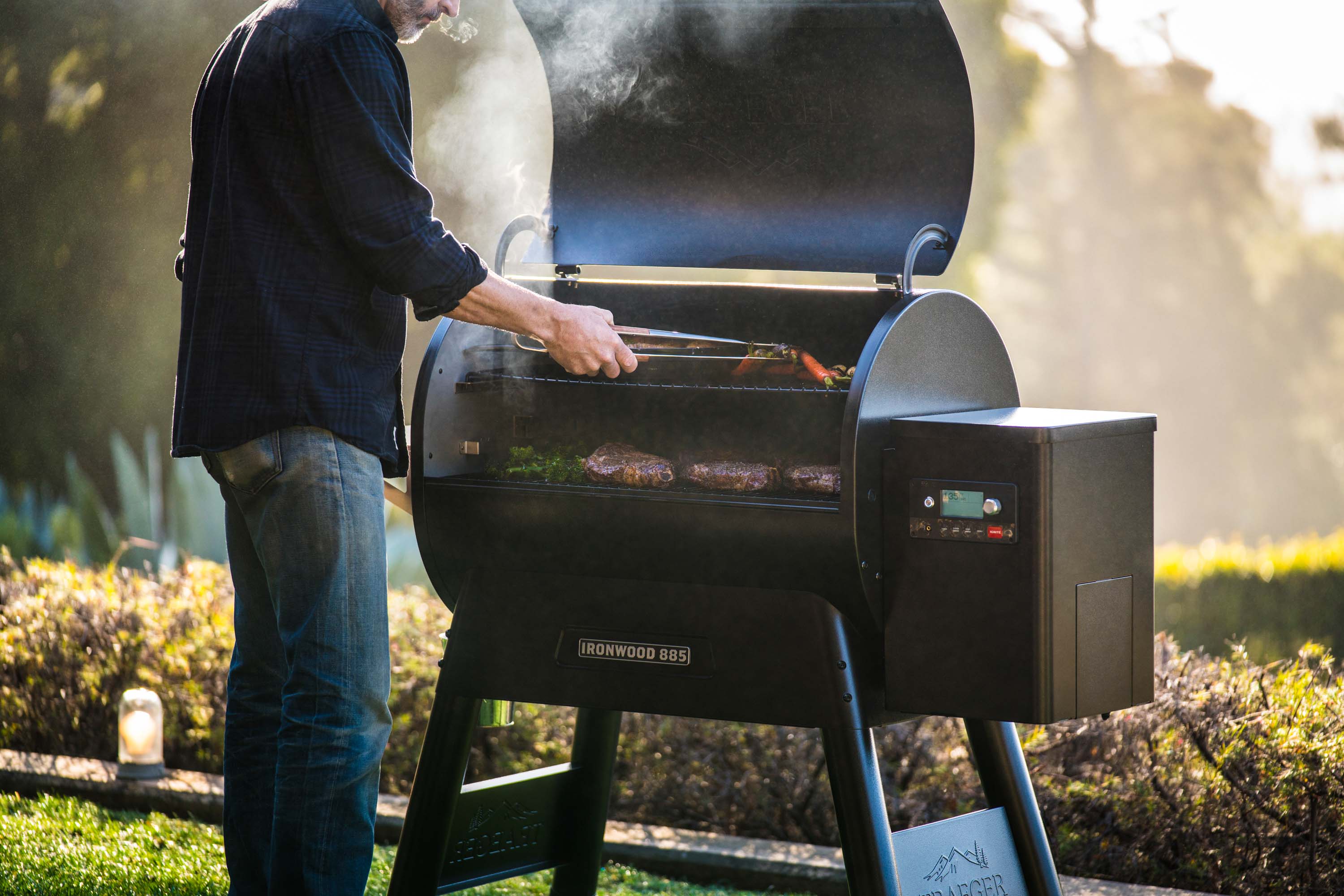 A man grilling outside